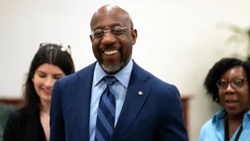 Raphael Warnock defends Biden