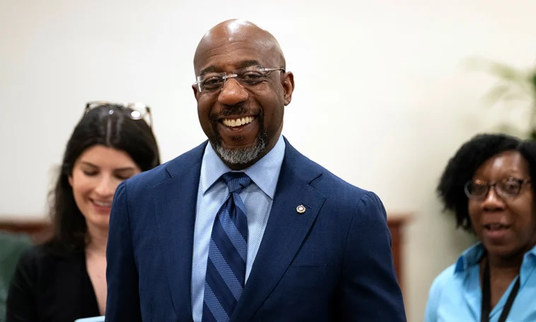 Raphael Warnock defends Biden